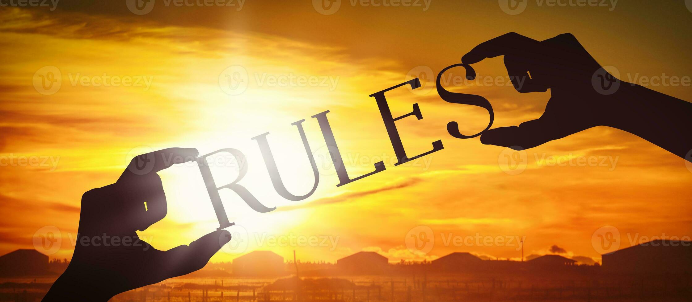 Rules - Human Hands Holding Black Silhouette Word photo