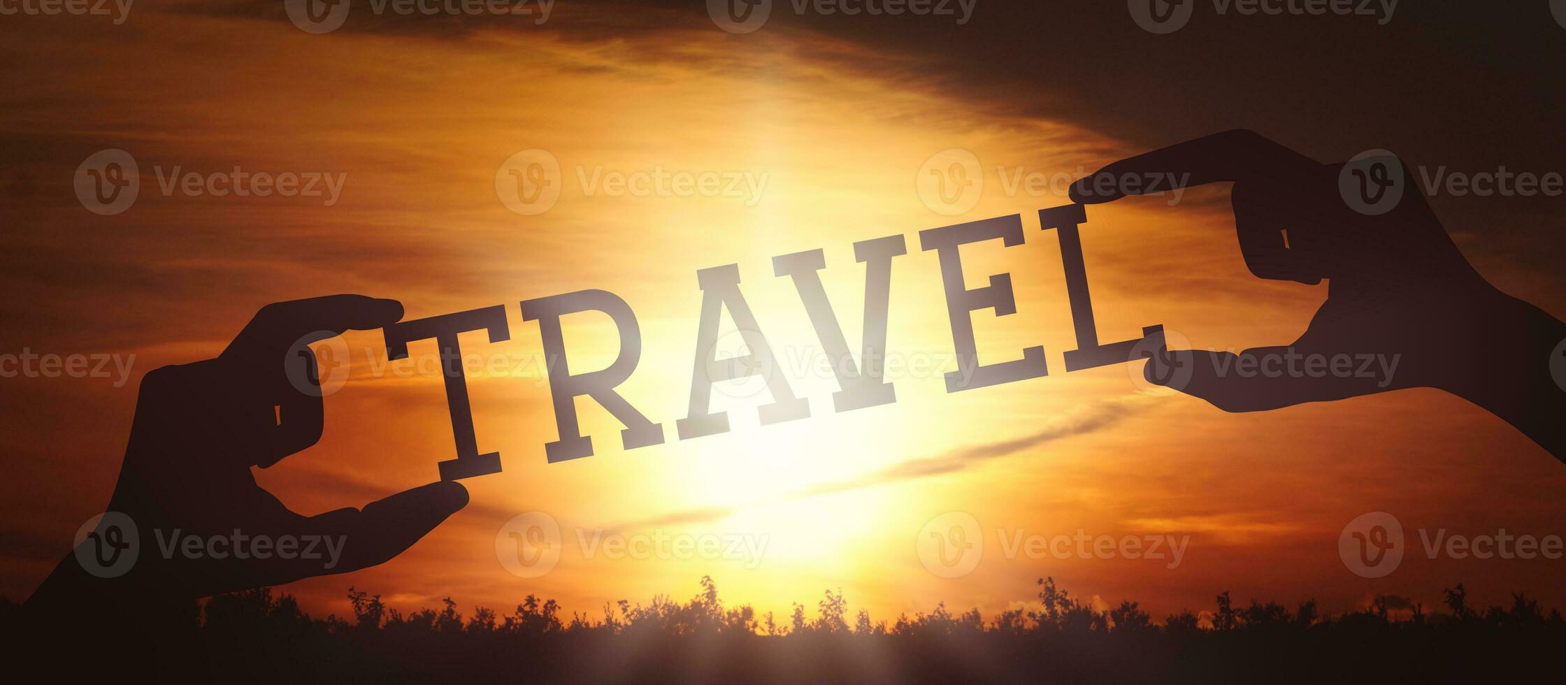 Travel - Human Hands Holding Black Silhouette Word photo