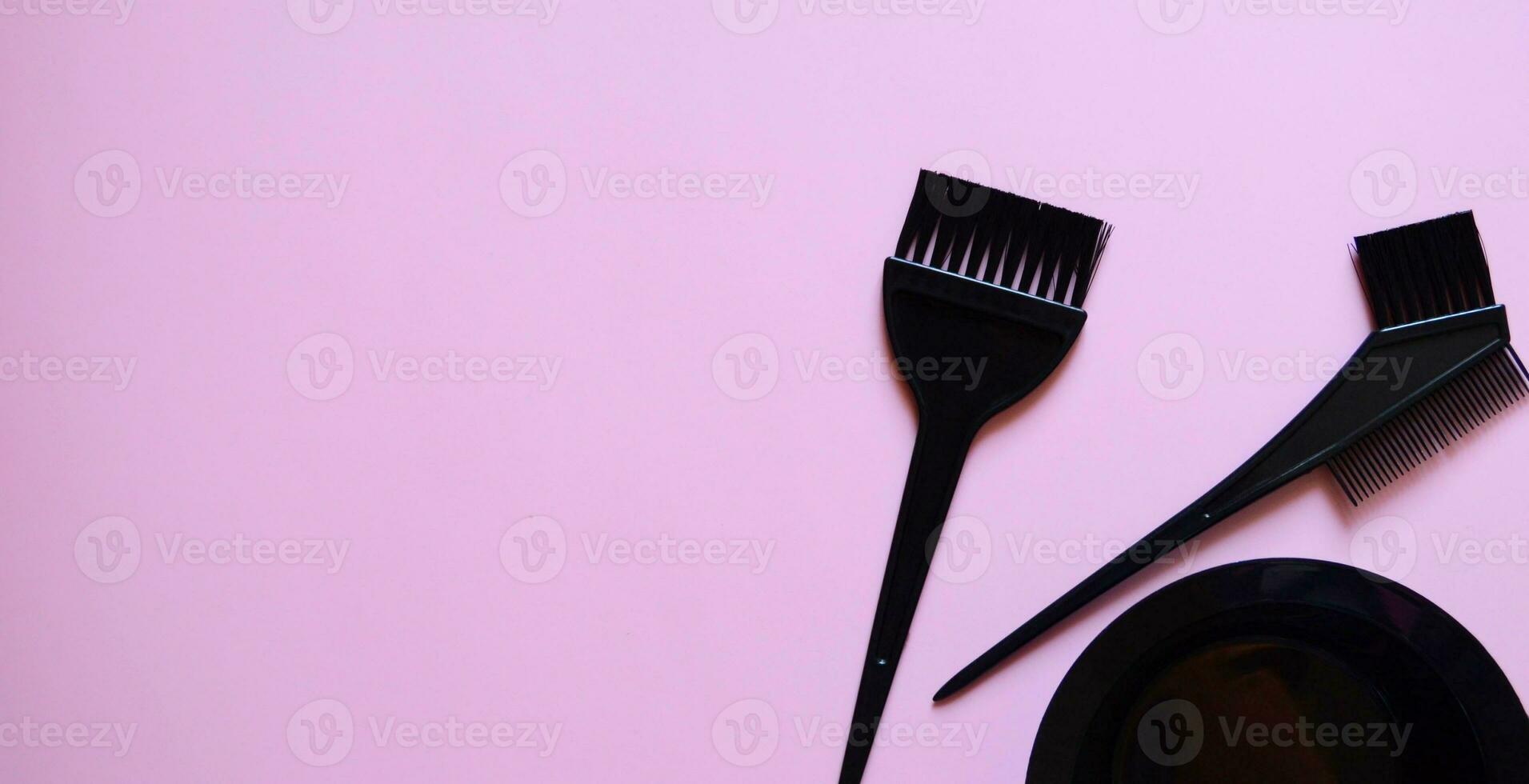 hairdressing brushes on pink background, hair coloring kit, beauty salon banner, pink background, template photo