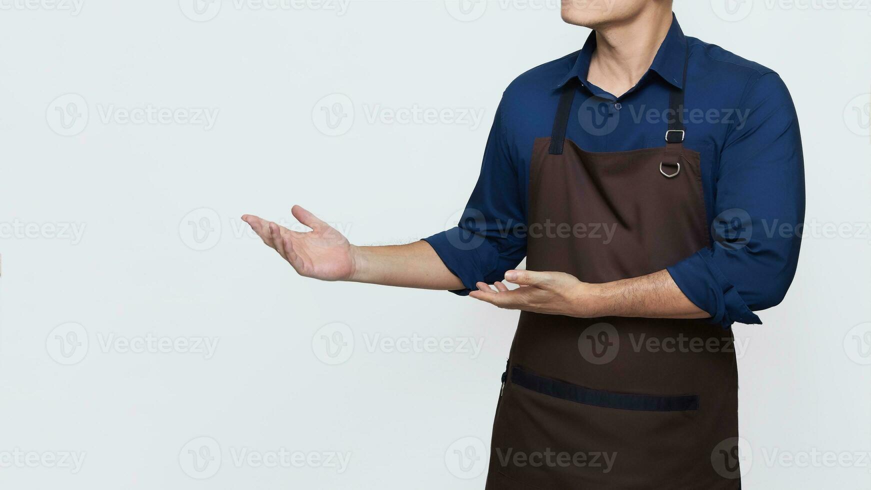 Asian Man wearing Apron in casual stylish clothing, standing tall welcoming pose with both hands showing something, no face isolated white background photo