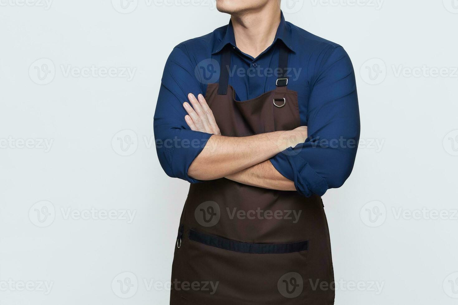 Asian Man wearing apron in casual stylish clothing, standing upright pose with folded hands, confident and calm gesture, no face isolated white background photo