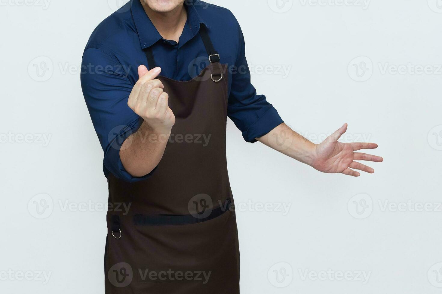 Asian Man wearing Apron in casual stylish clothing, standing upright pose with fingers making the saranghaeyo or 'I love you' gesture in Korean, no face isolated white background photo