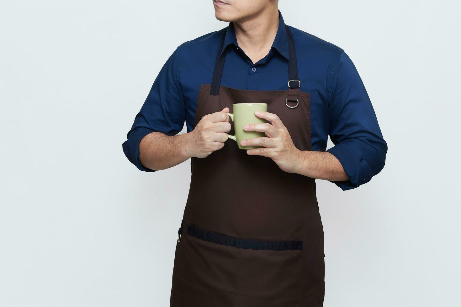 Asian Man wearing Apron in casual stylish clothing, standing upright pose while holding a glass of drink, calm and confident gesture, no face isolated white background photo