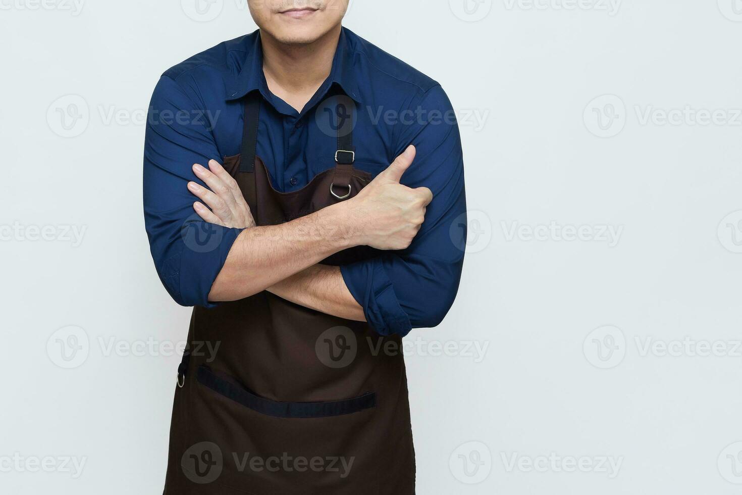 Asian Man wearing Apron in casual stylish clothing, standing upright pose with folded hands and one hand giving a thumbs up, no face isolated white background photo