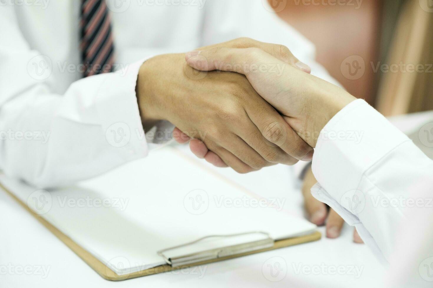 Judge and Businessman shaking hands after behind-the-scenes advice at attorney services concept courtroom. photo