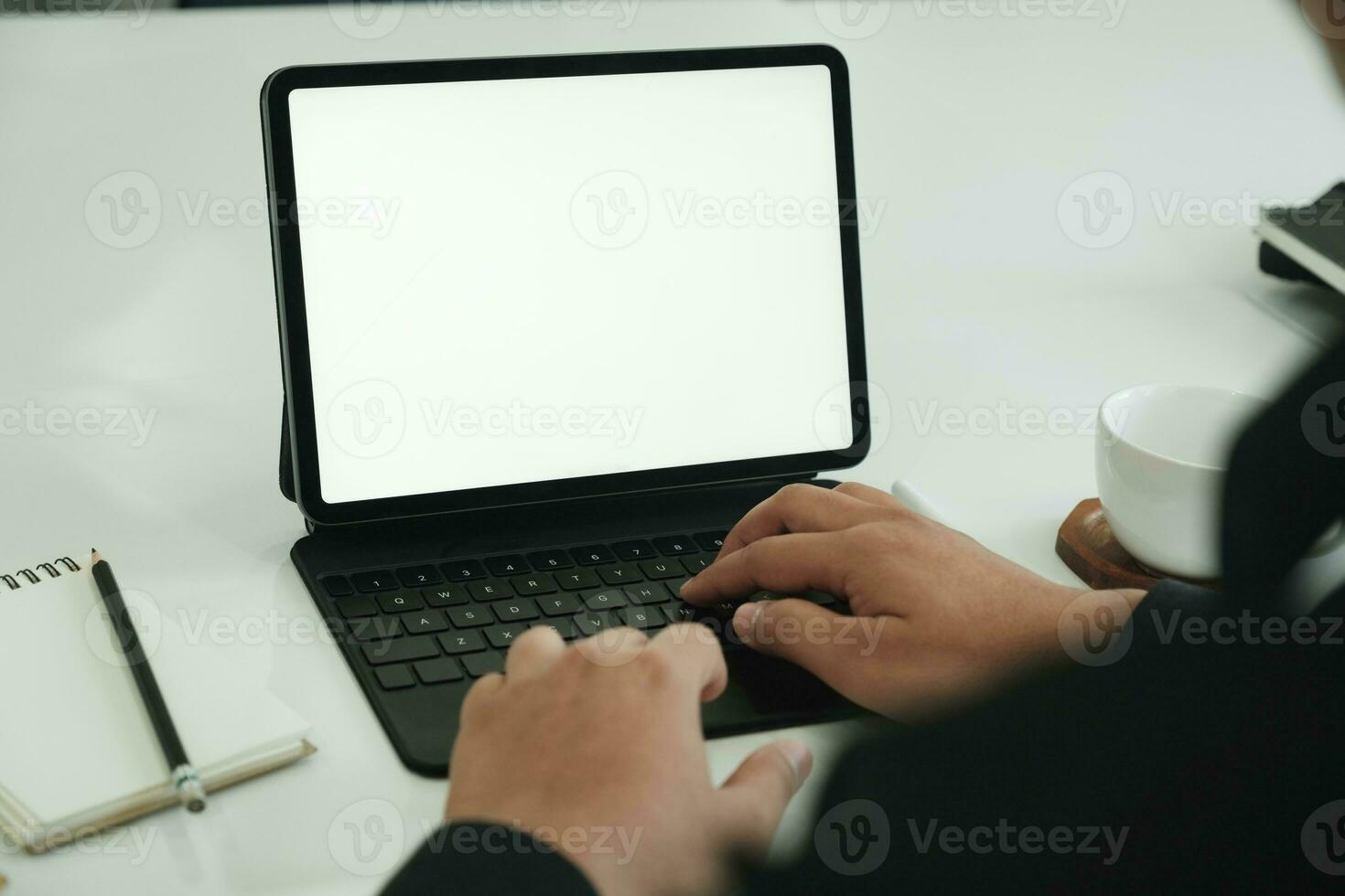 Closeup businessman working with digital tablet in office room photo