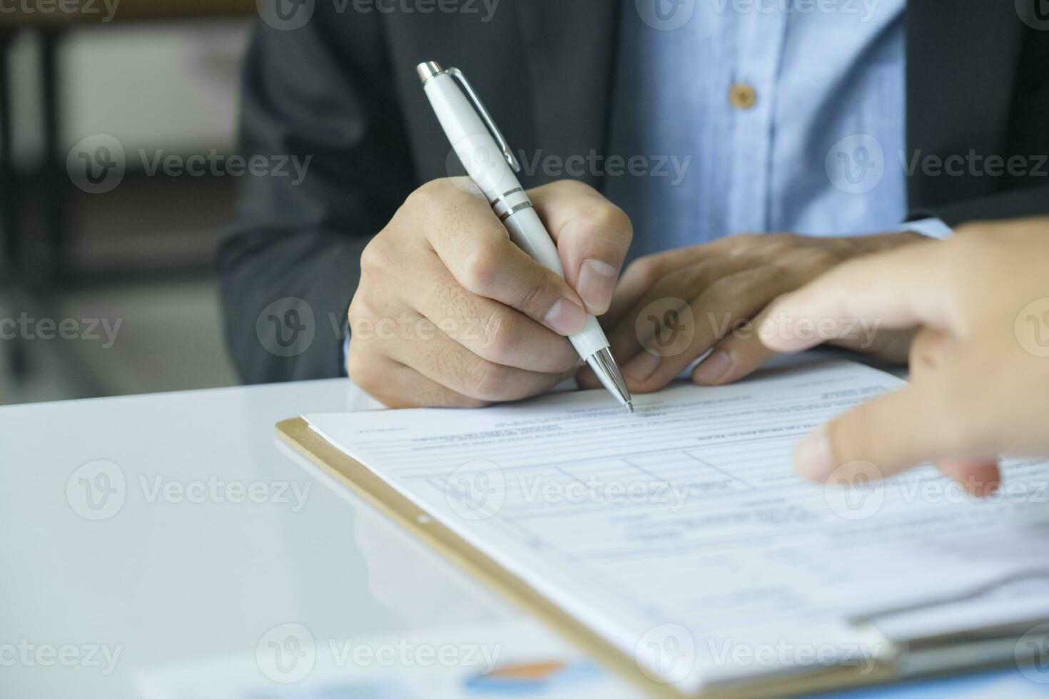 Business man sign a contract investment professional document agreement. photo