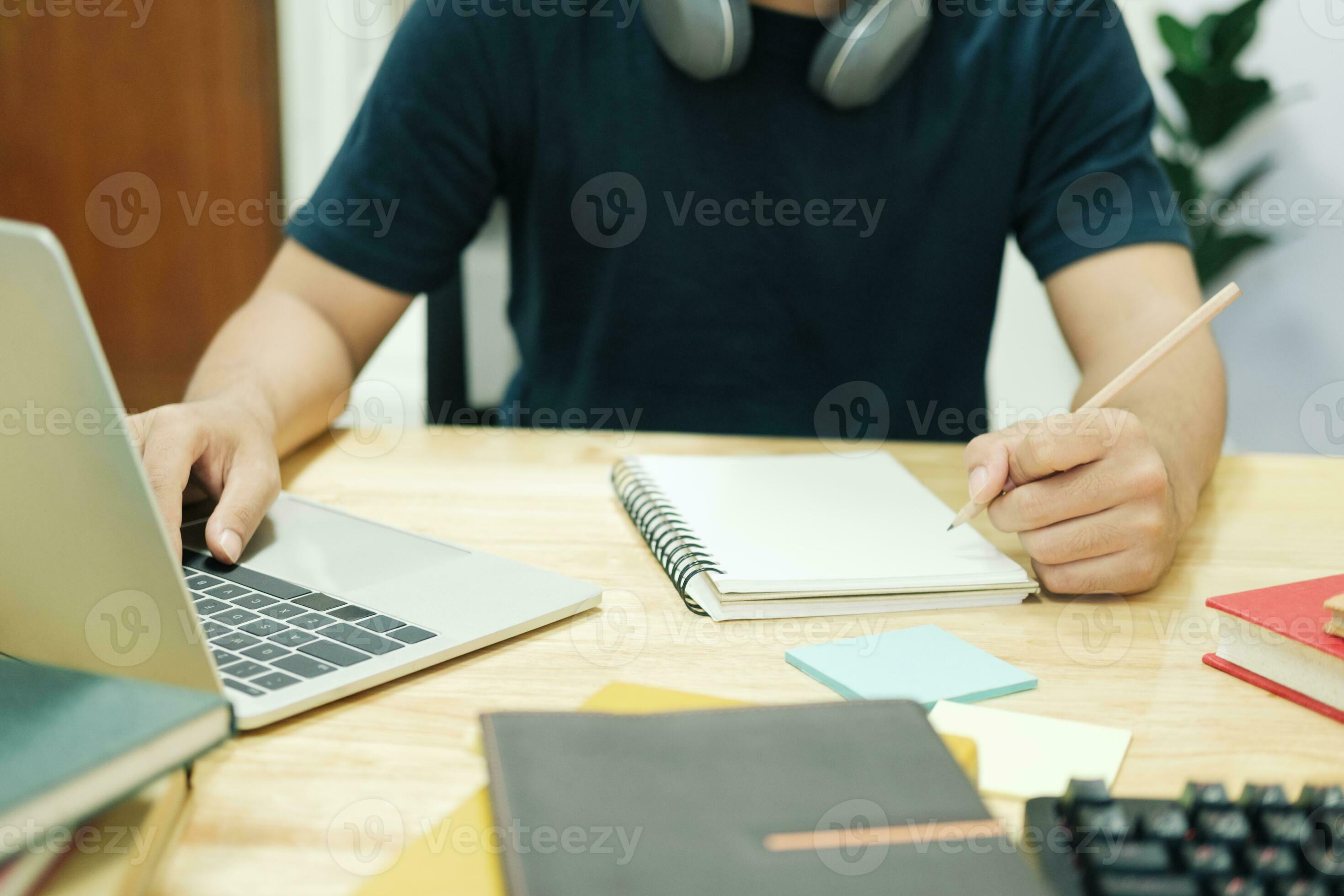 Young man study in front of the laptop computer at home 23852997 Stock ...