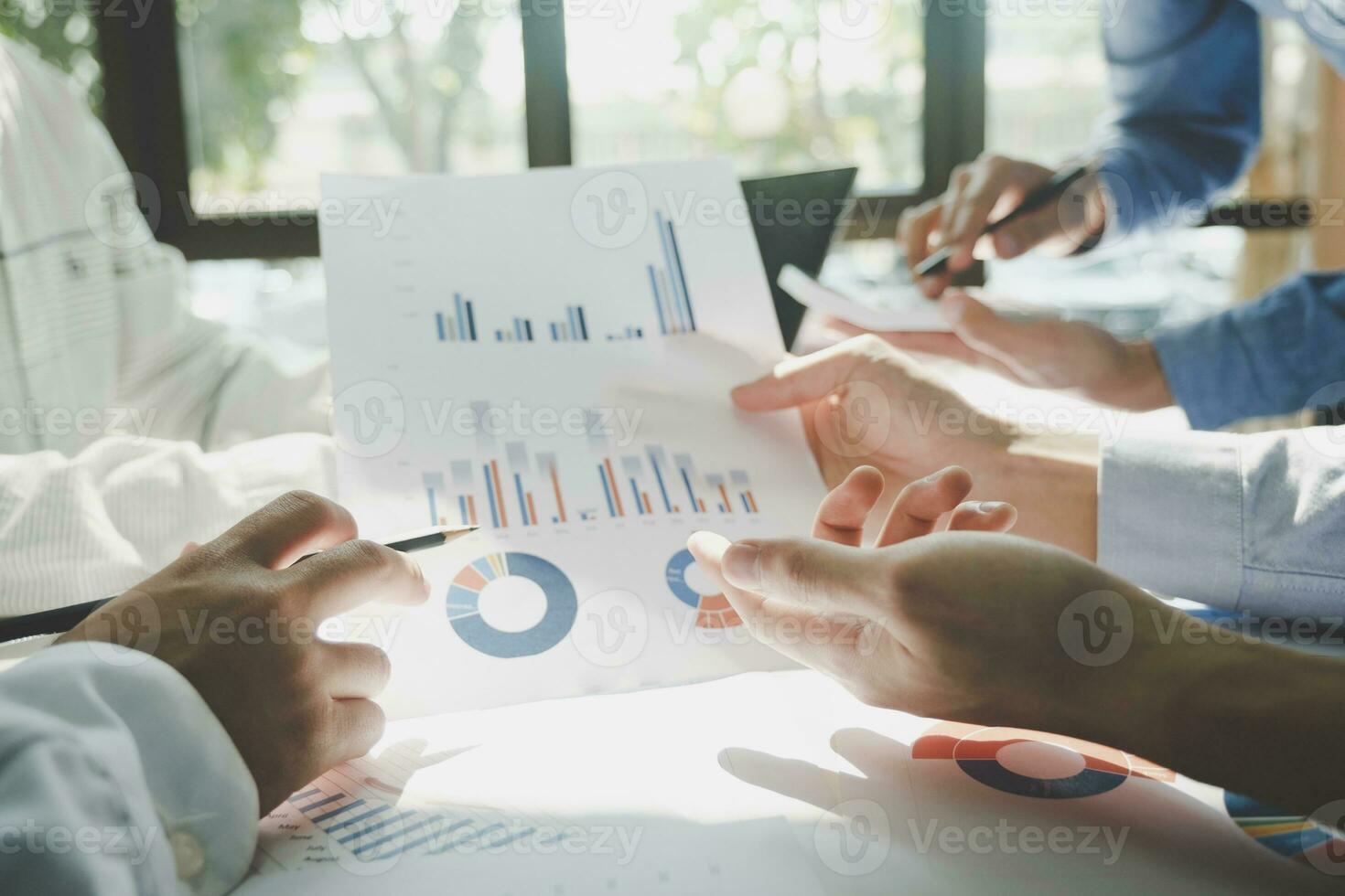 Businessmen working together at desk. photo