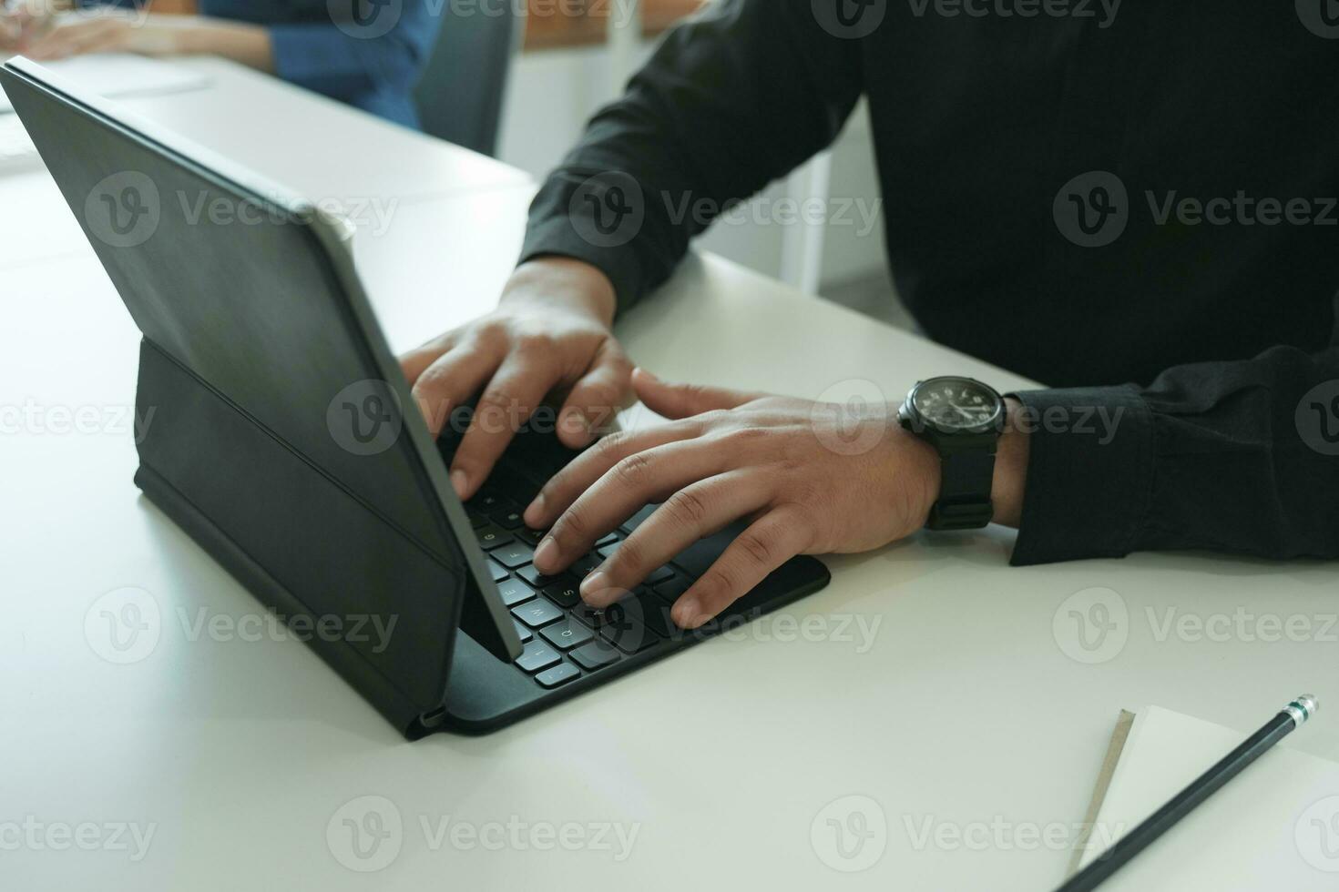 Closeup businessman working with digital tablet in office room photo