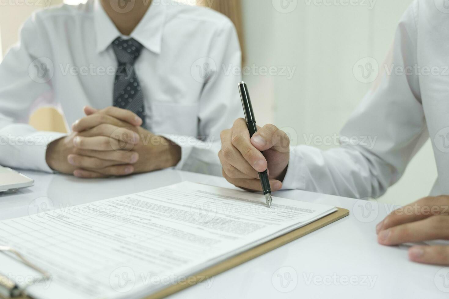 Close up businessman signing contract, partnership agreement, making deal. photo