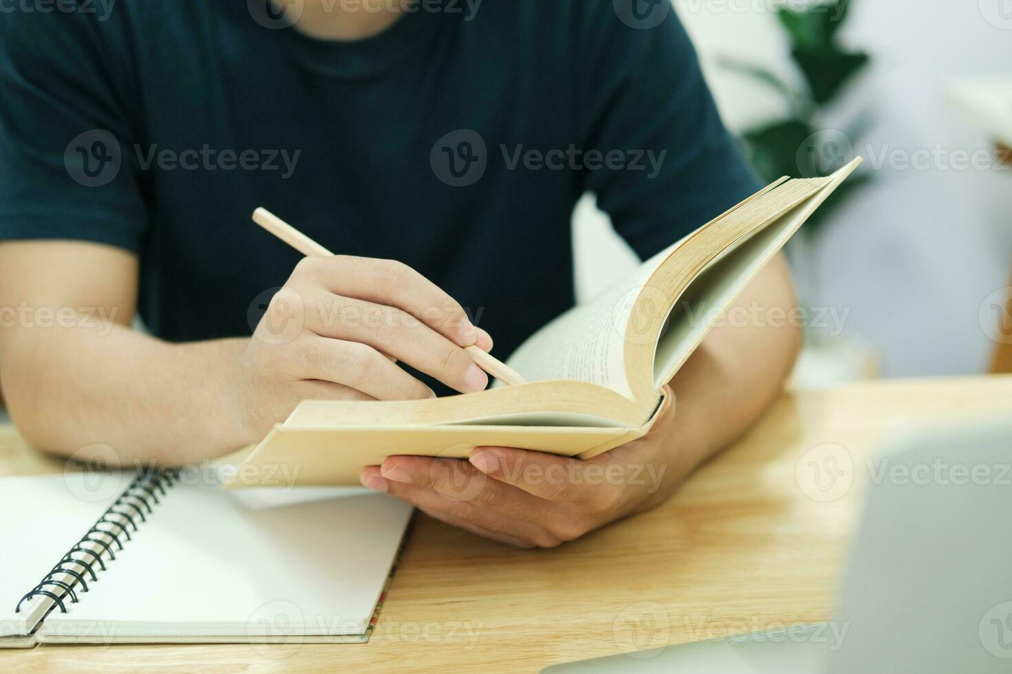 Young man study in front of the laptop computer at home. photo