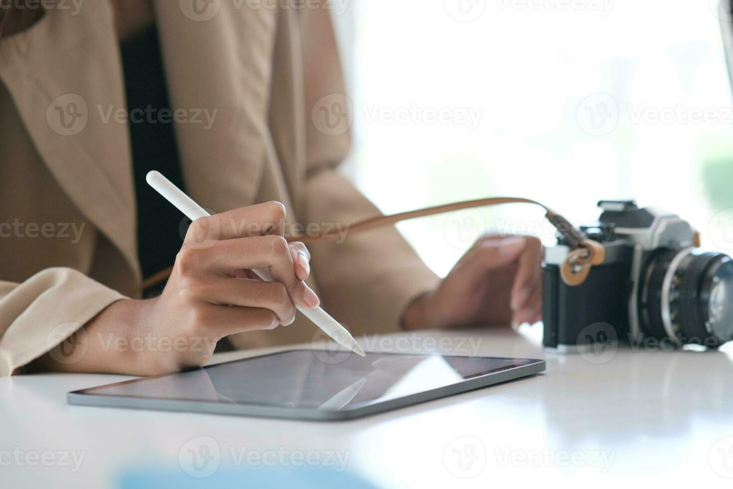 Businesswoman working on with mock-up tablet using stylus pen. photo