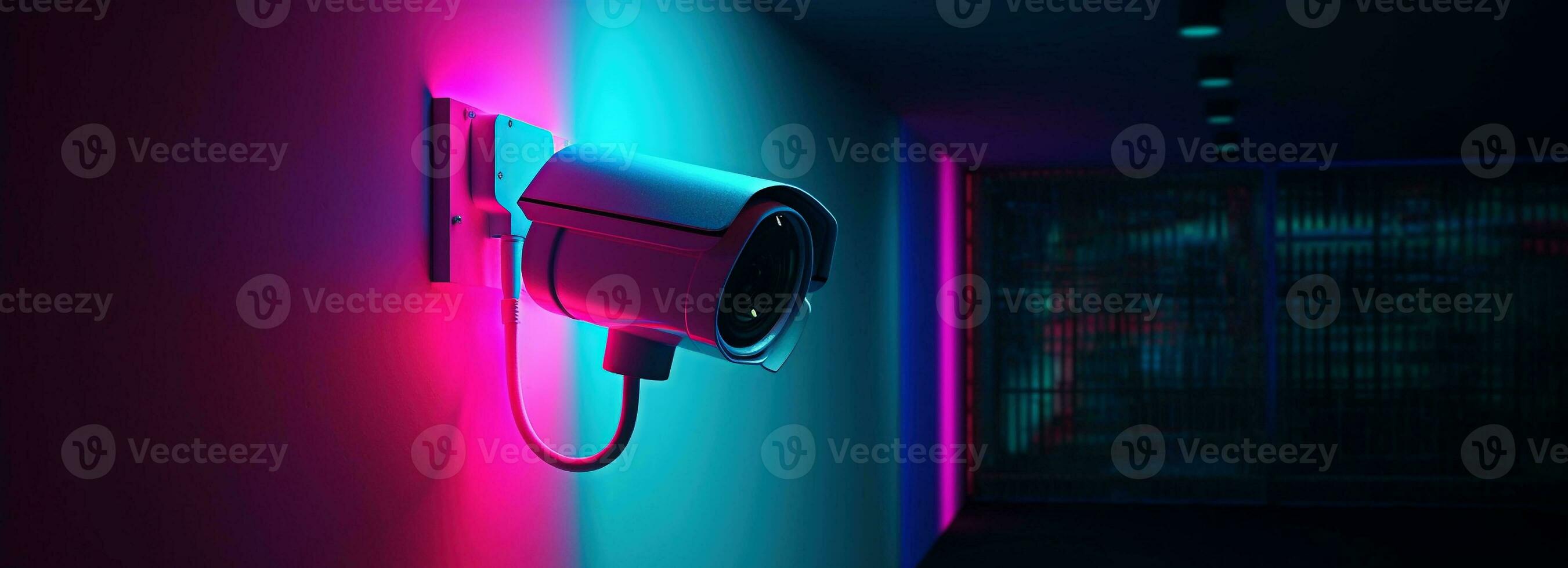 Modern CCTV camera on a wall. A neon light night cityscape background. Concept of surveillance and monitoring. Toned image double exposure mock up. photo