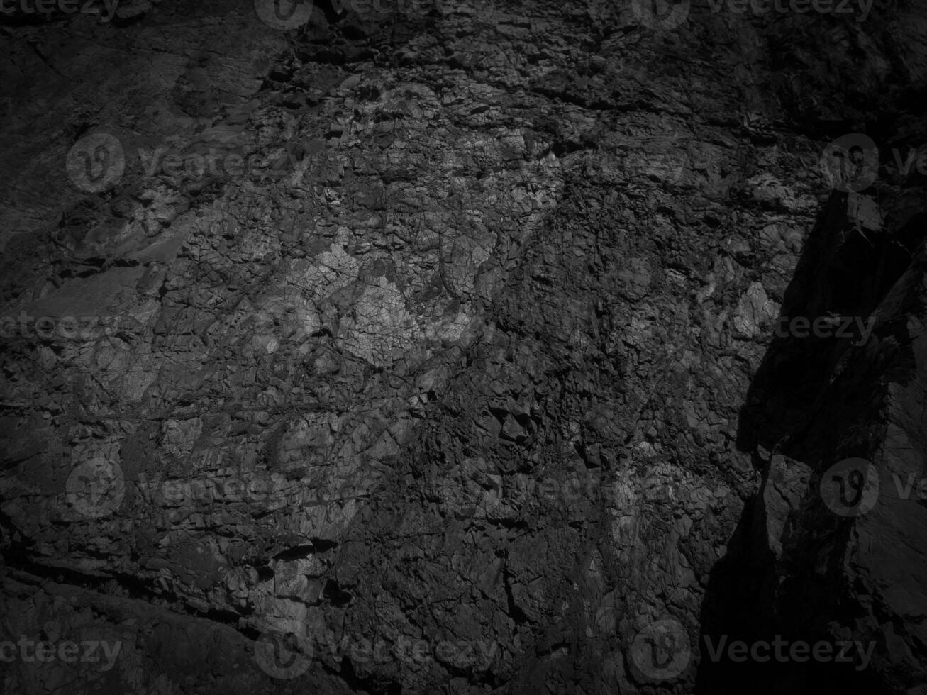 Black stone background. Long black stone texture and textured. Dirty black stone wall. Rock texture with cracks. stone tile floor texture. Old wall texture abstract natural background. photo