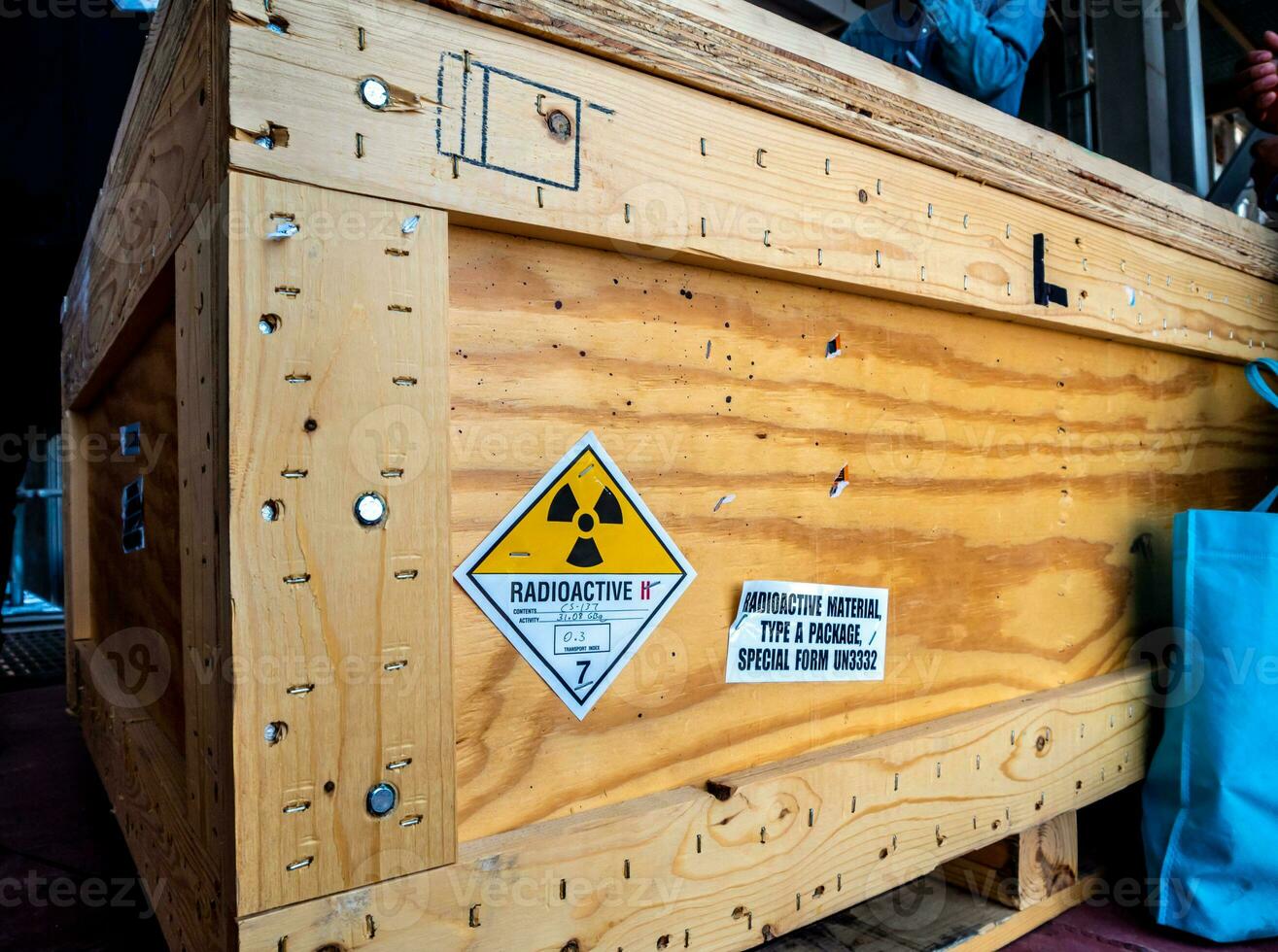 Radiation label beside the transport wooden box Type A package photo