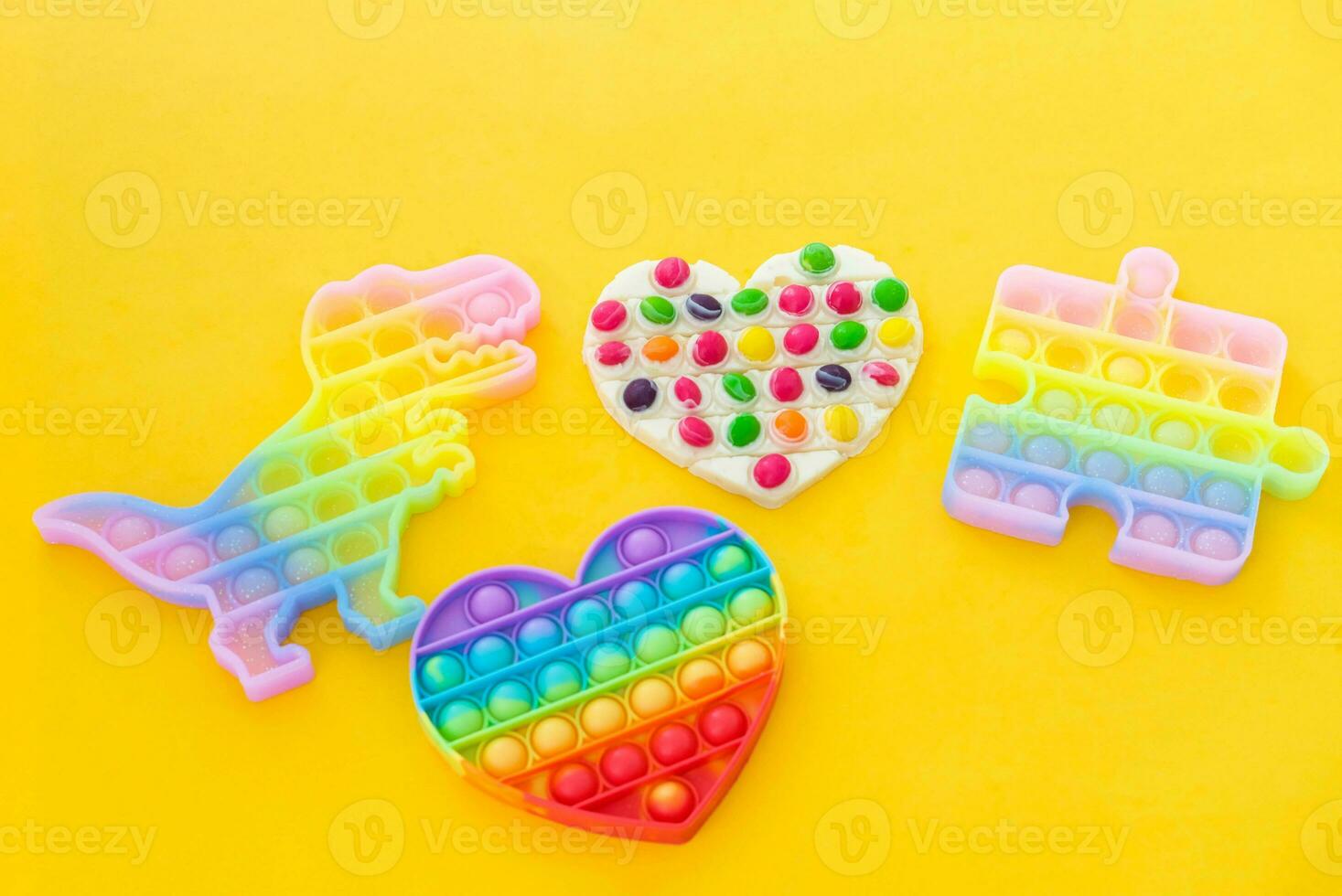 Use the popular pop it toy as a chocolate mold. White chocolate and colorful candies and popit silicone toy. DIY concept. Step-by-step photo instructions. Step 11.