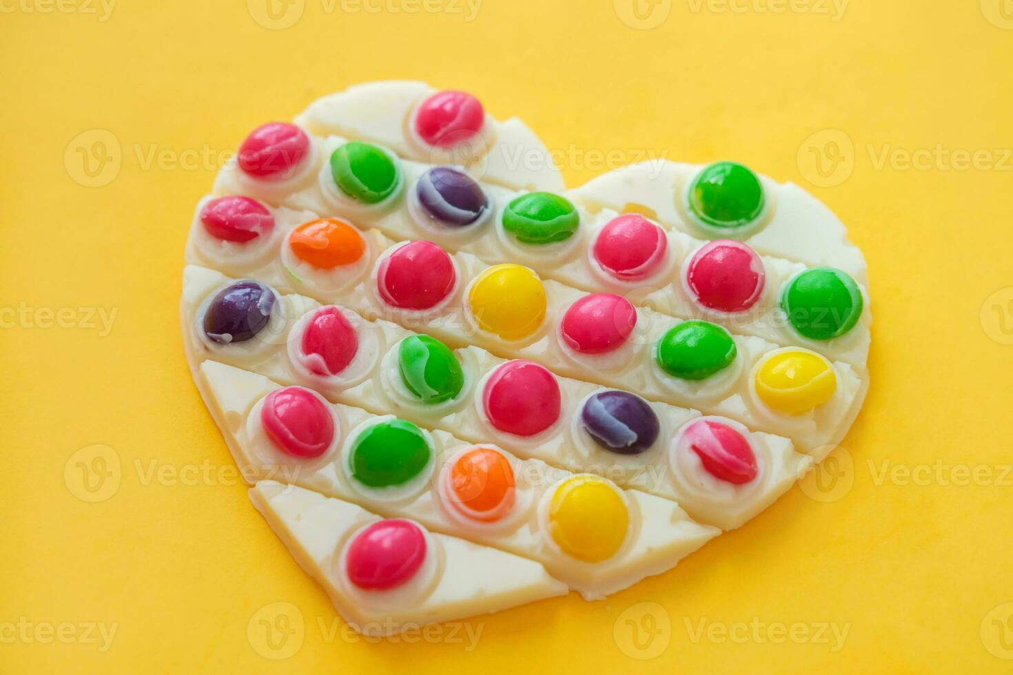 Use the popular pop it toy as a chocolate mold. White chocolate and colorful candies and popit silicone toy. DIY concept. Step-by-step photo instructions. Step 11.