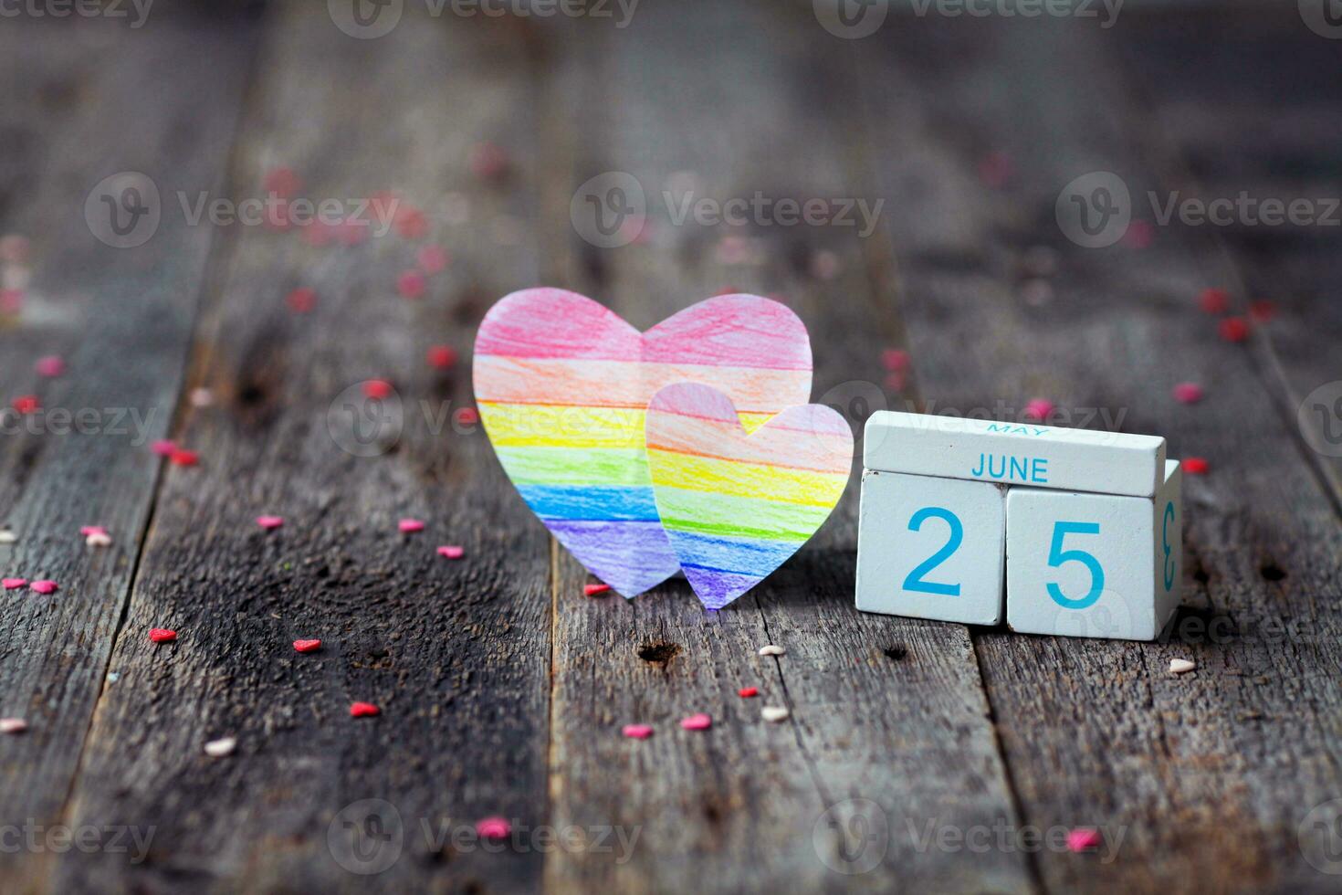 Rainbow Flag Day. Calendar with date 25 June and a heart with a rainbow painted in the color of the lgbt flag. photo
