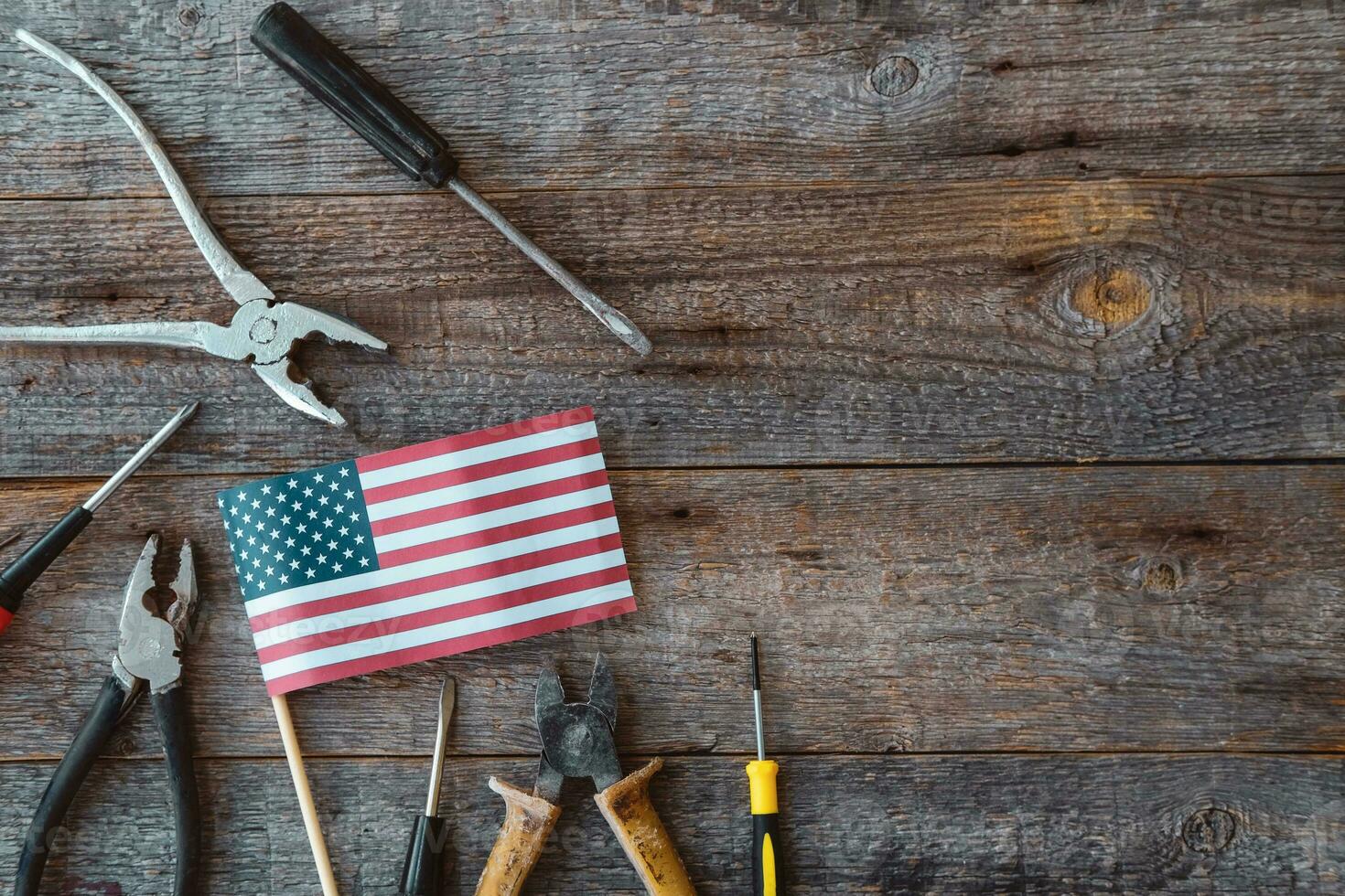 Many American flags and sequins on a wooden background, flat lay. A holiday in America. 4th of july, happy independence day of the united states. Happy labour day. photo