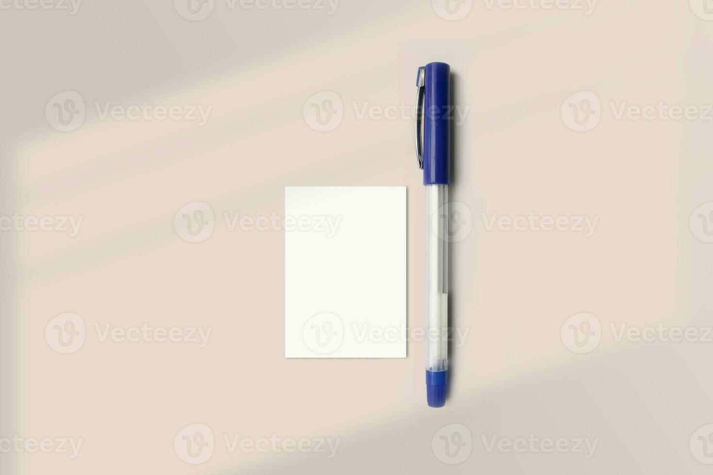 Realistic A8 paper flatlay mockup with a pen. Portrait A8 International Paper Size mockup top view. Simple, clean, modern, minimal super small paper mock up flat lay concept photo