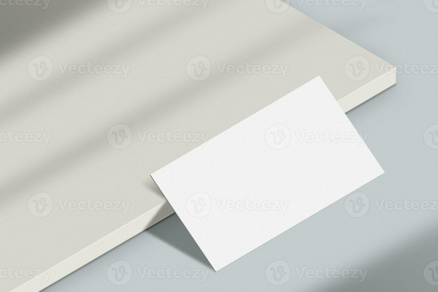 Realistic business card mockup. Simple blank business card on an elegant light background. Business card mock up with shadow overlay effect photo