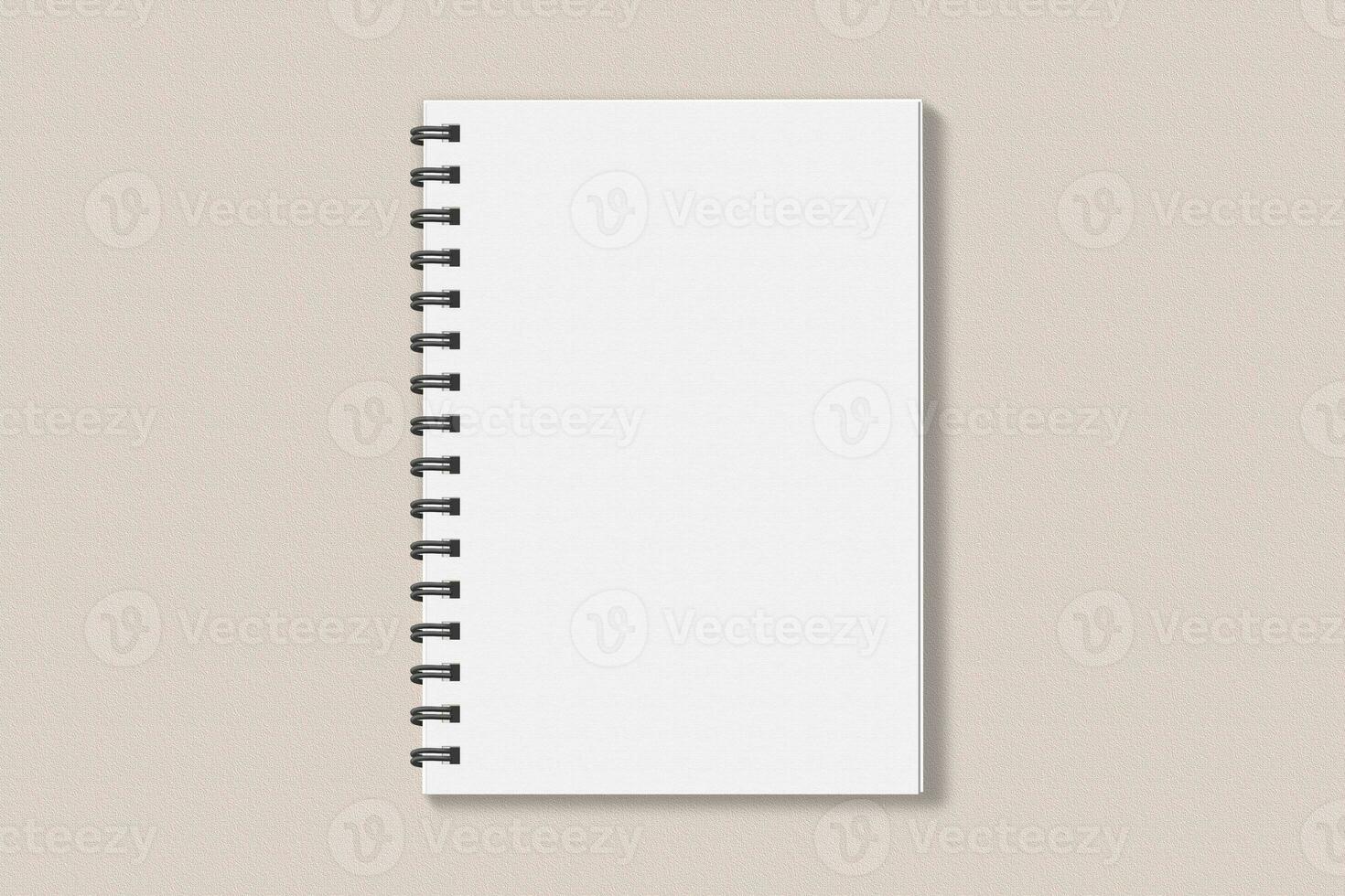 Realistic spiral notebook blank cover mockup flatlay. Simple blank note book mock up on clean background top view. White empty notepad cover to place your design, flat lay concept photo