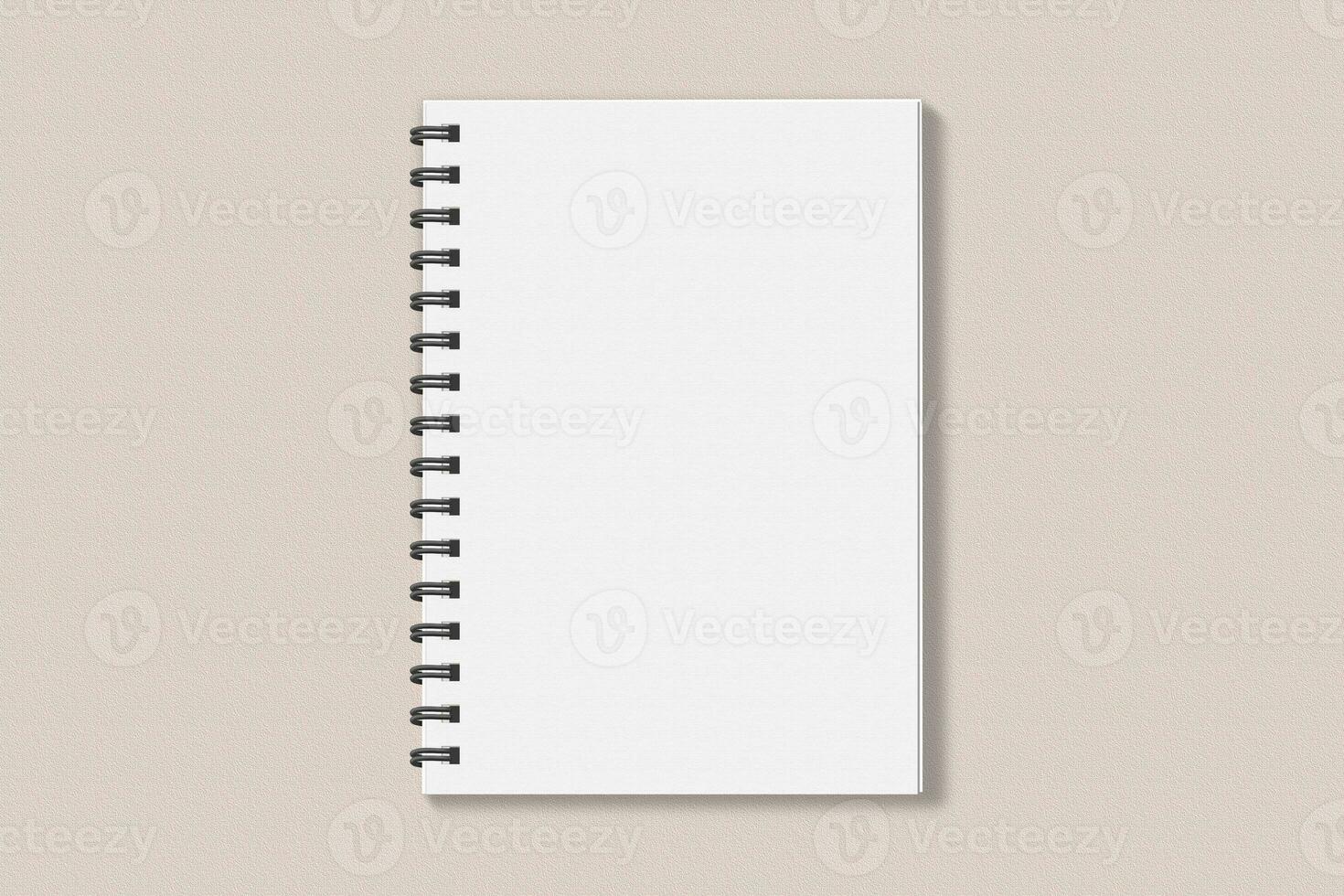 Realistic spiral notebook blank cover mockup flatlay. Simple blank note book mock up on clean background top view. White empty notepad cover to place your design, flat lay concept photo