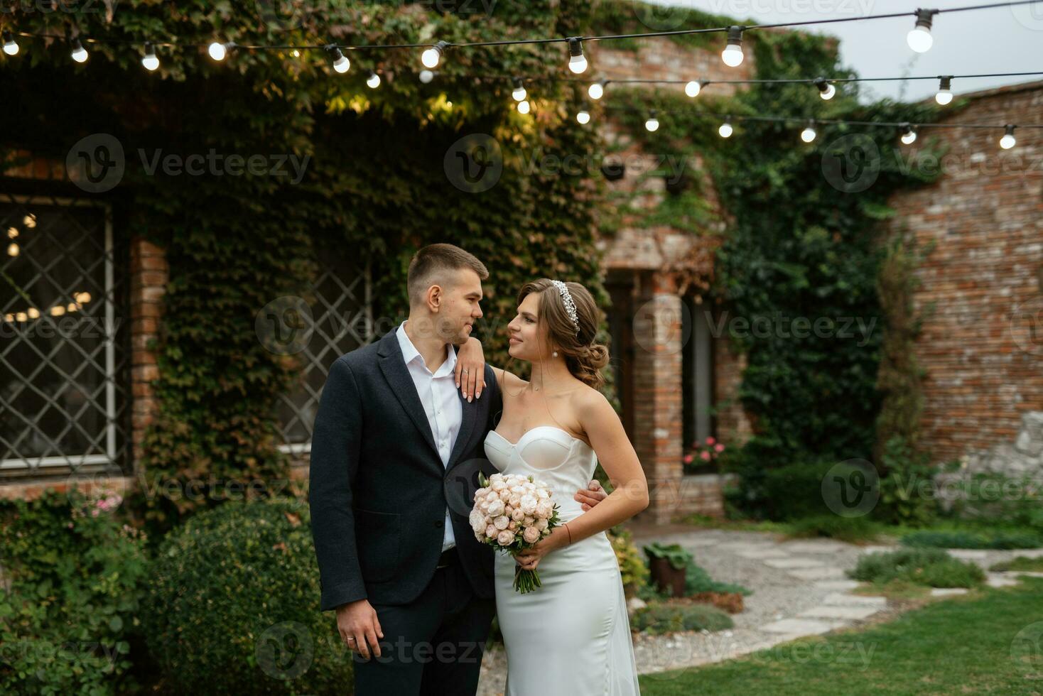 portrait of a young couple of bride and groom on their wedding day photo