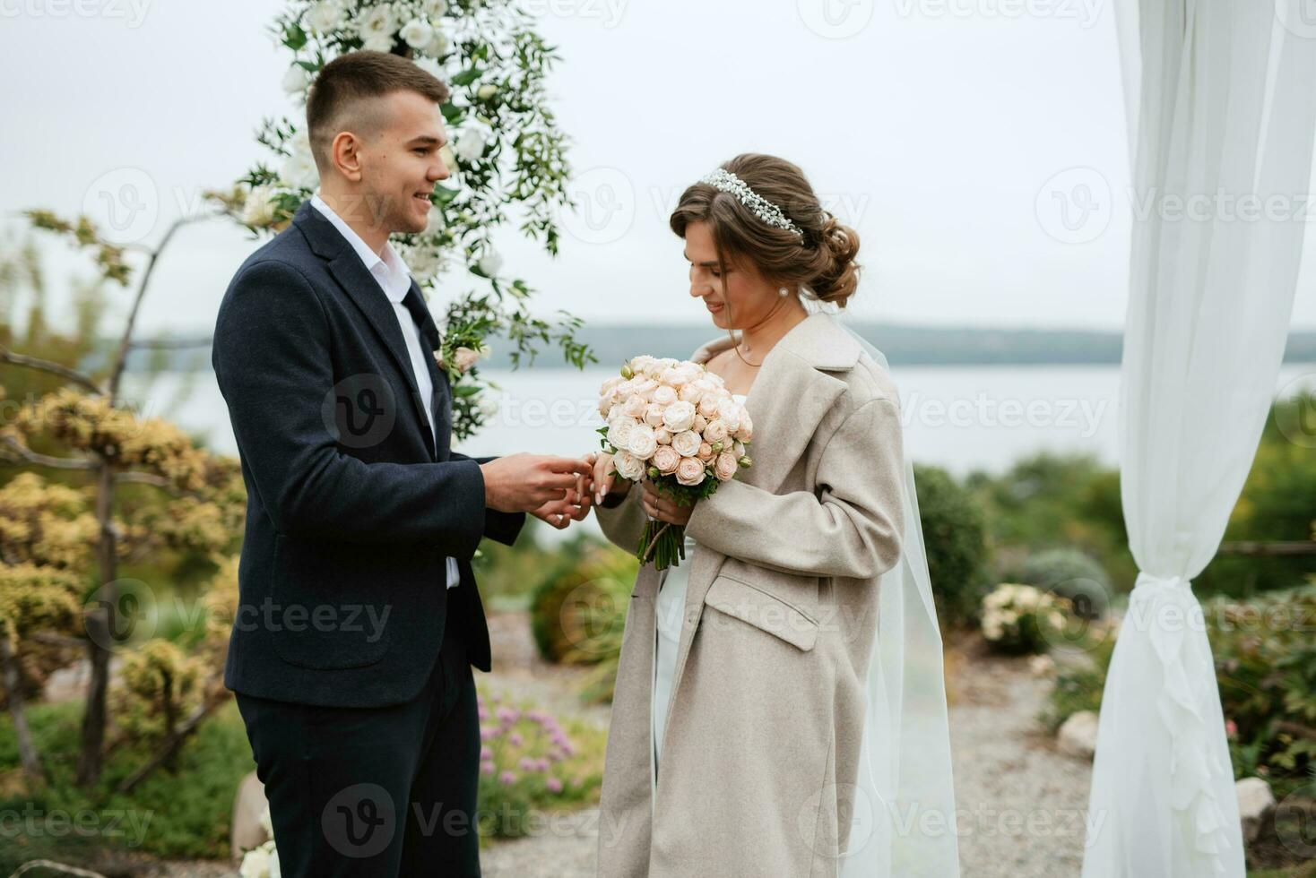 wedding ceremony of the newlyweds in a country cottage photo