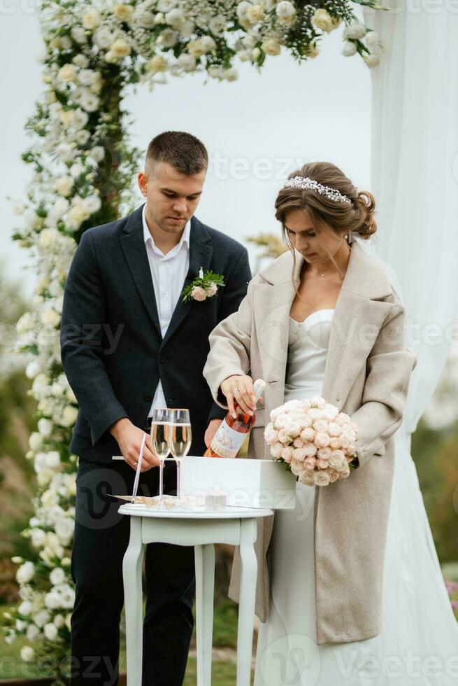 wedding ceremony of the newlyweds in a country cottage photo