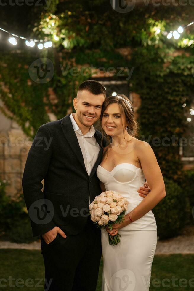 portrait of a young couple of bride and groom on their wedding day photo