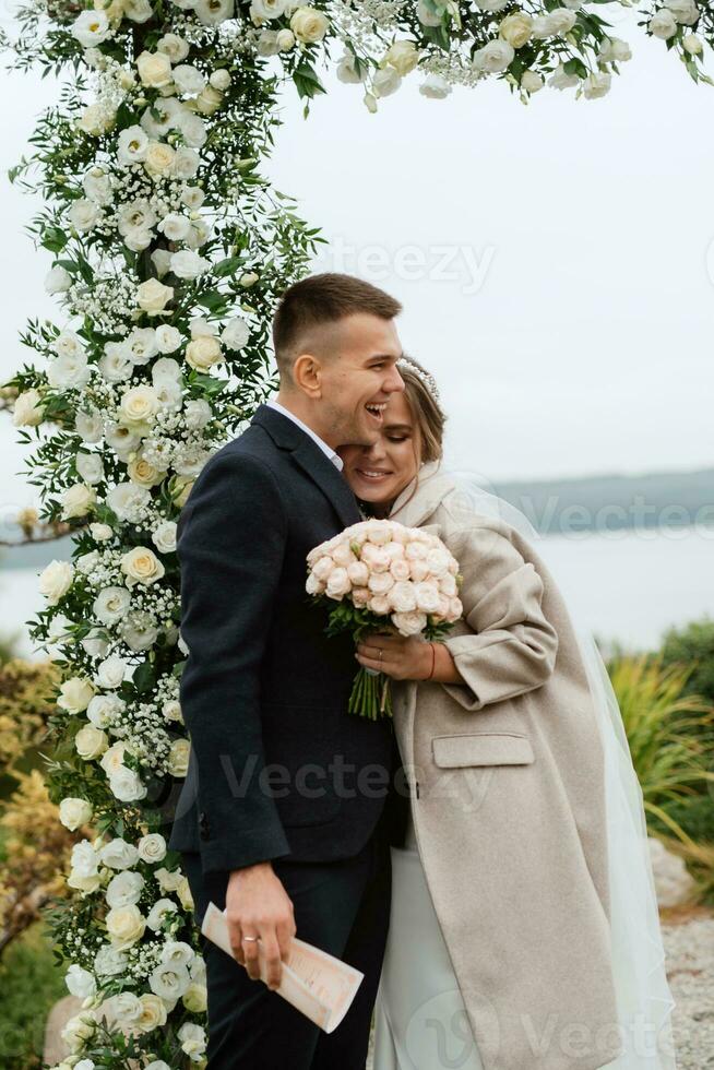 wedding ceremony of the newlyweds in a country cottage photo