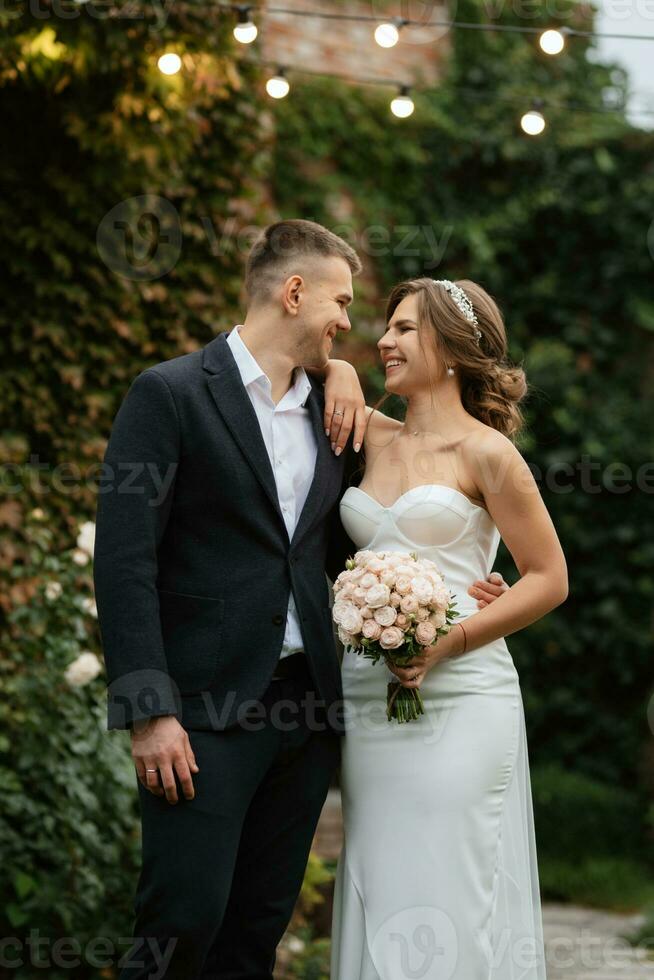 portrait of a young couple of bride and groom on their wedding day photo