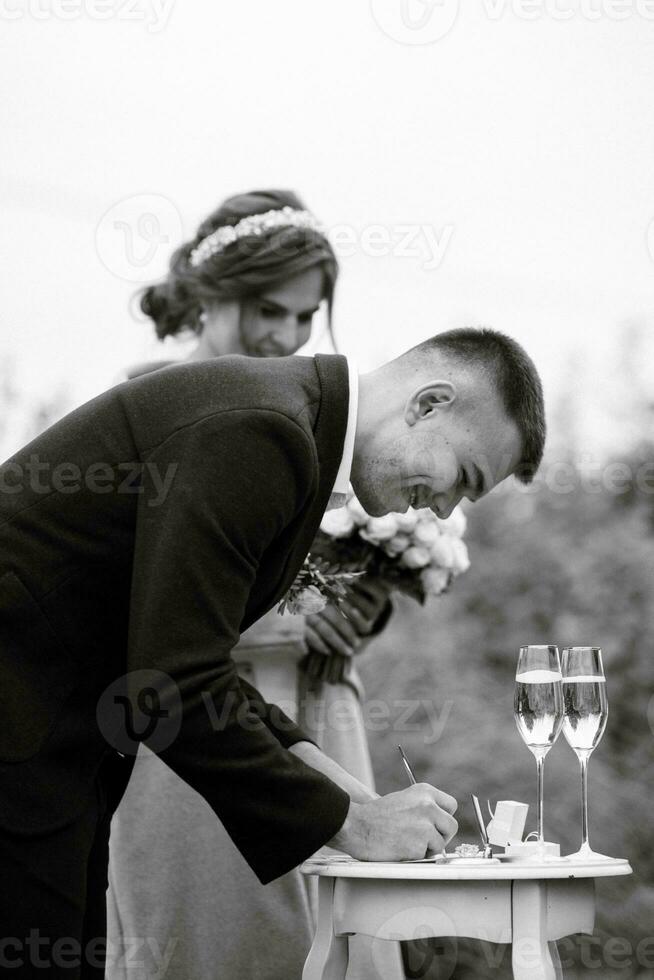 wedding ceremony of the newlyweds in a country cottage photo