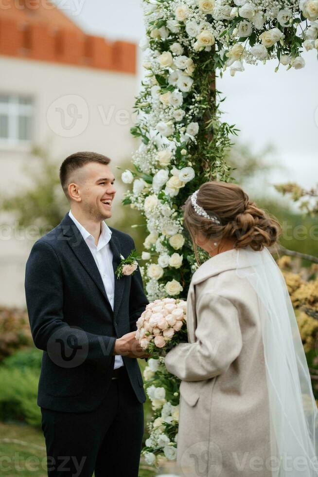 wedding ceremony of the newlyweds in a country cottage photo