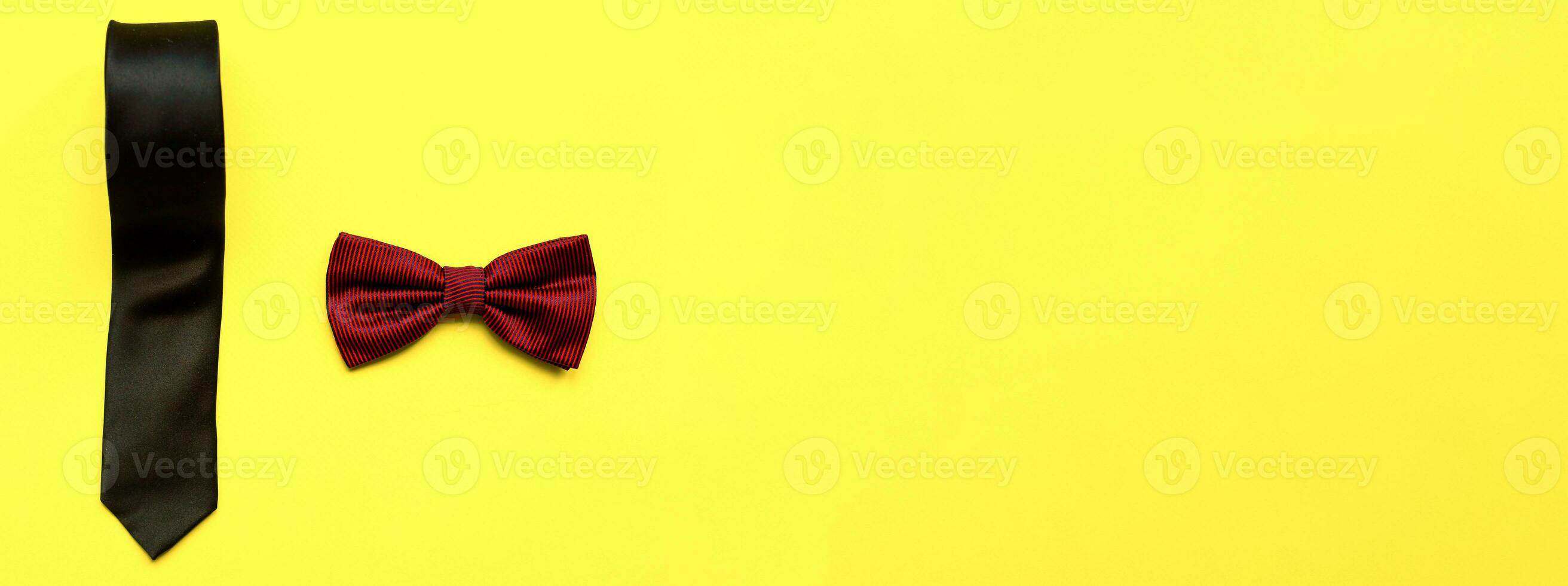 Banner Flat lay bow tie and necktie on a yellow background. Happy fathers day. Male attributes photo