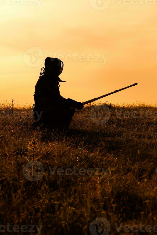 Kendo fighter with shinai photo