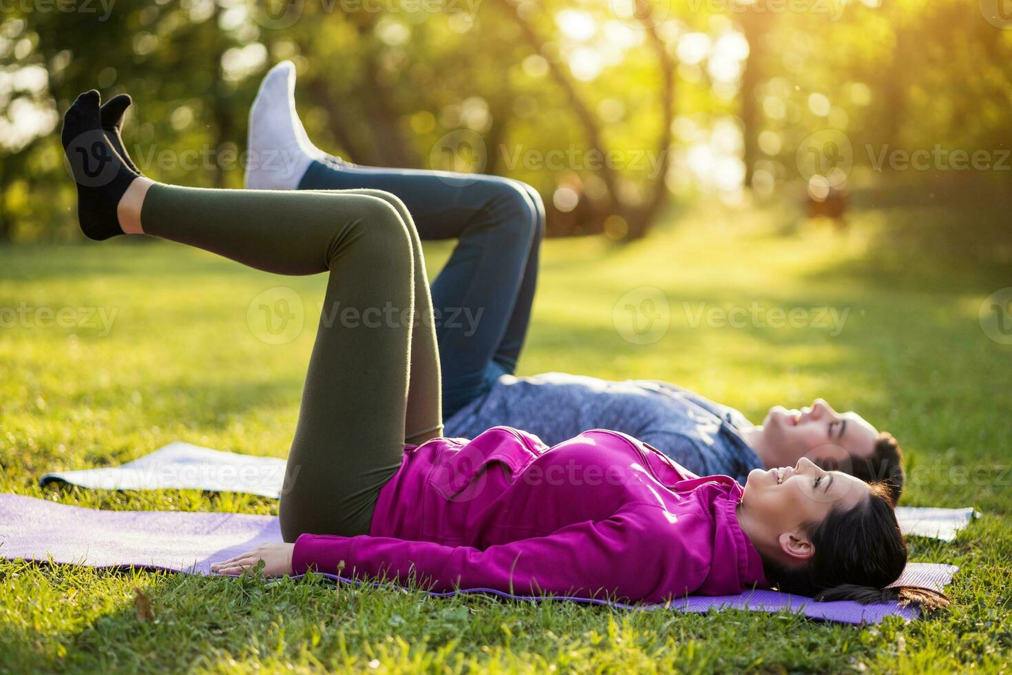 Couple exercising together in the park photo