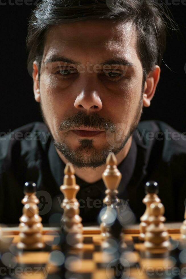 A man playing chess photo