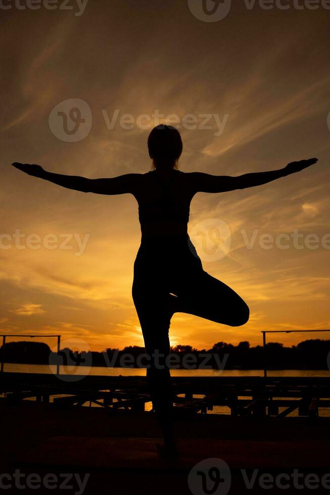 A woman doing physical exercises photo