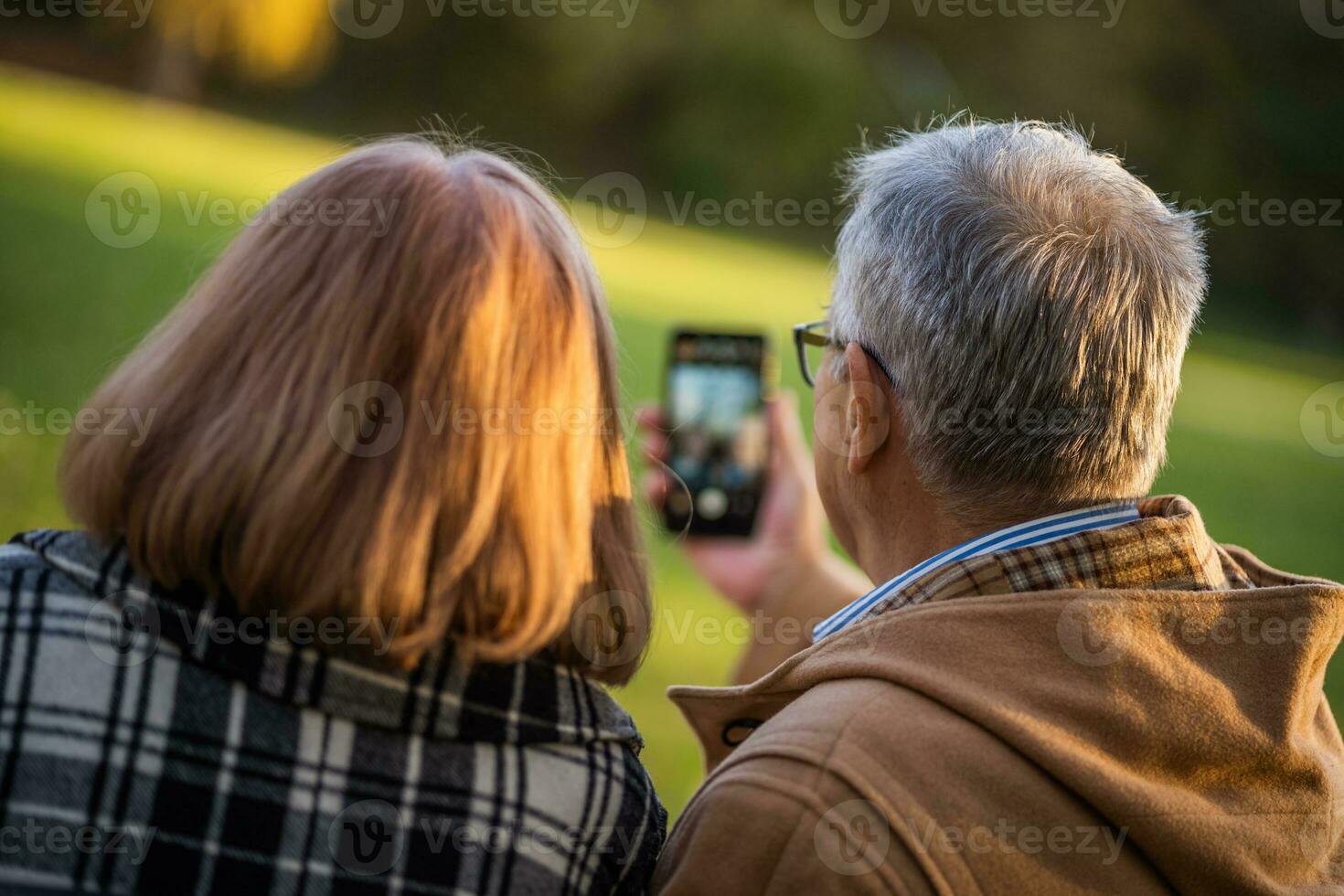 A senior couple spending time together in the park photo