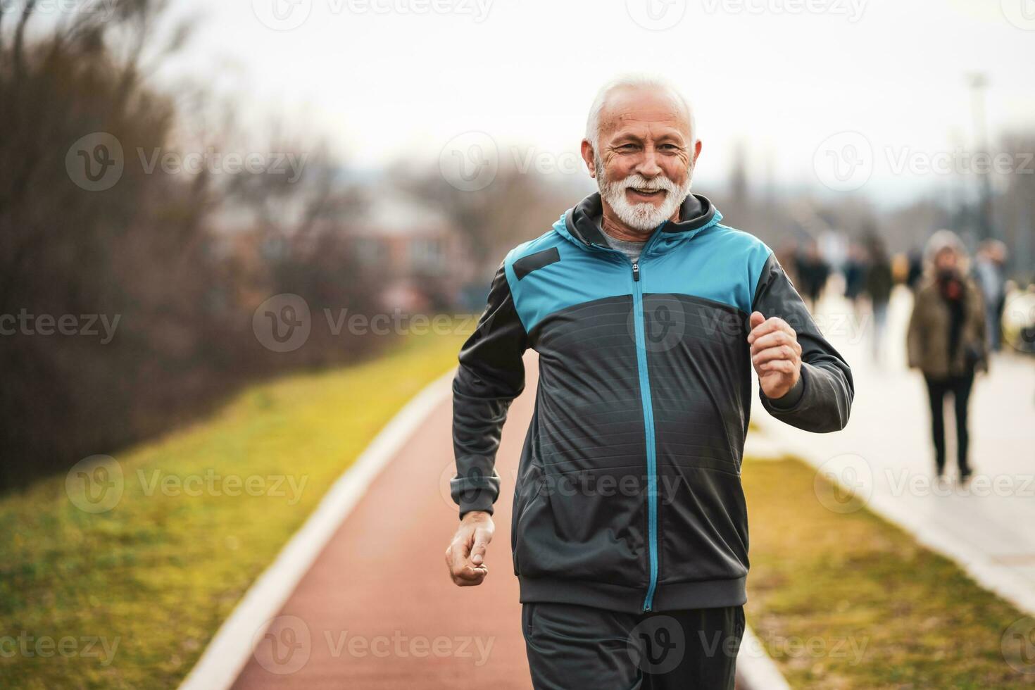 A senior man doing physical exercises photo