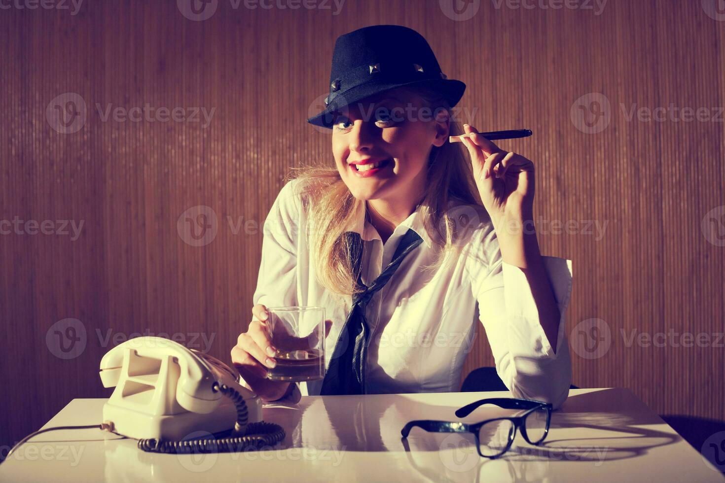 A woman smoking cigar photo