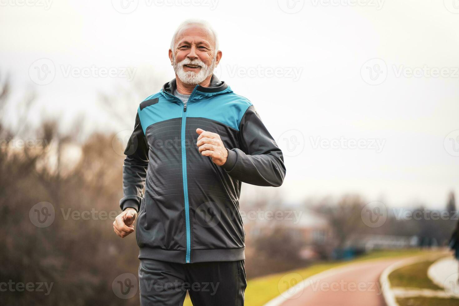 A senior man doing physical exercises photo