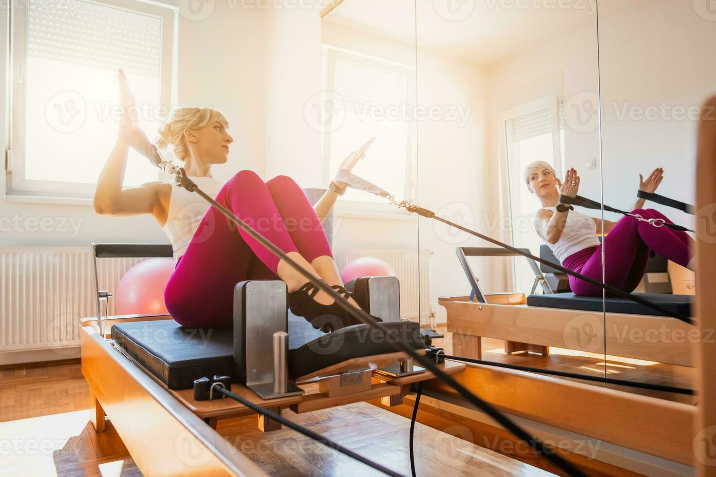 A woman doing pilates indoors photo