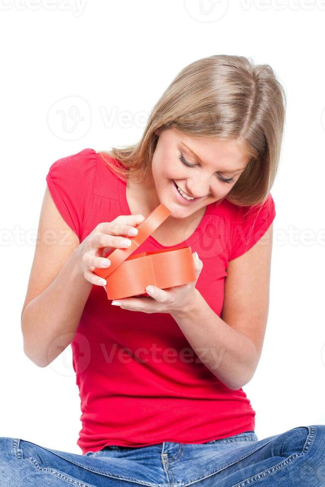 A woman opening a gift photo