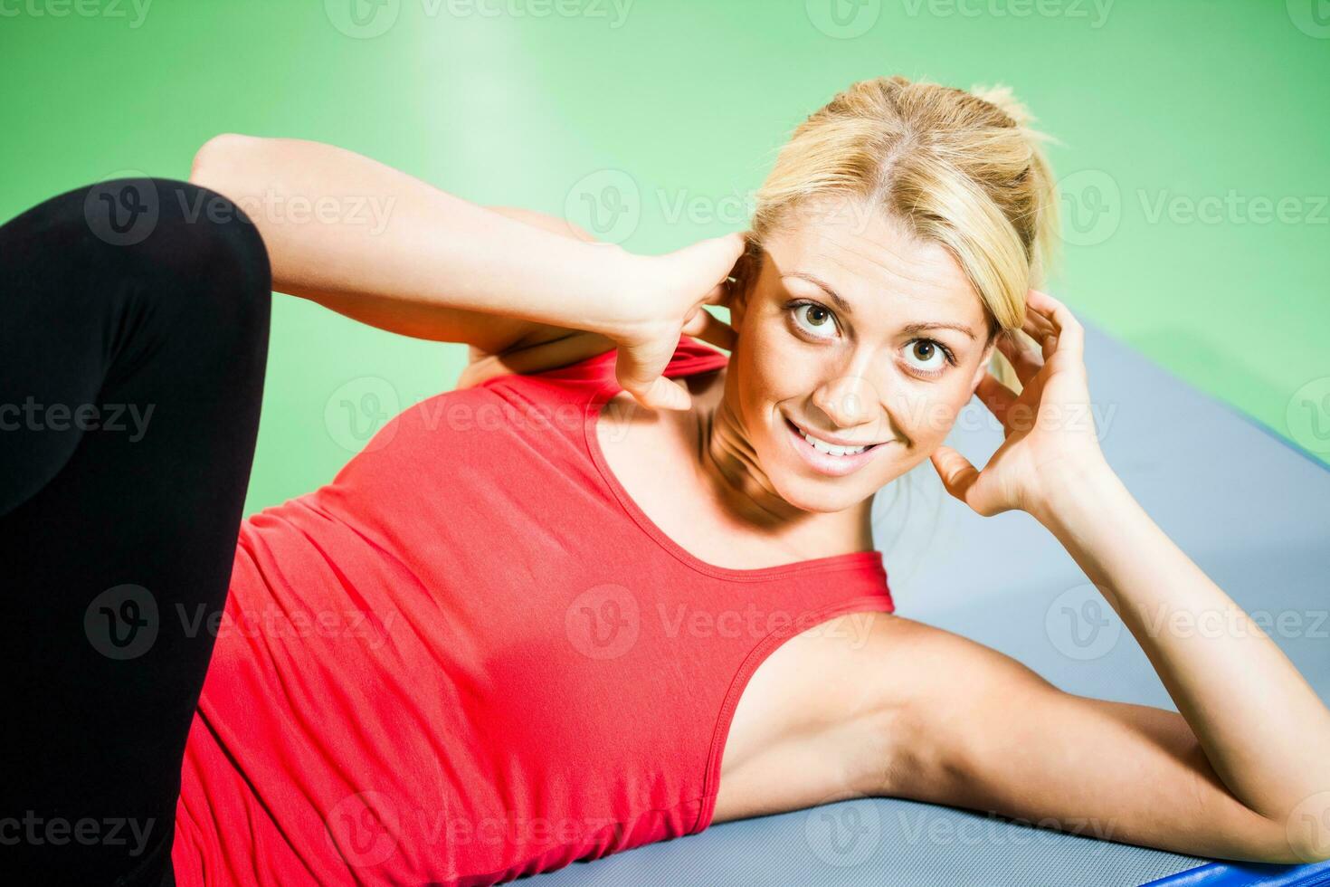 A woman doing physical exercises photo