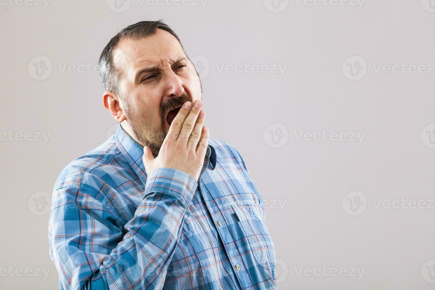 Portrait of a man with blue plaid shirt photo