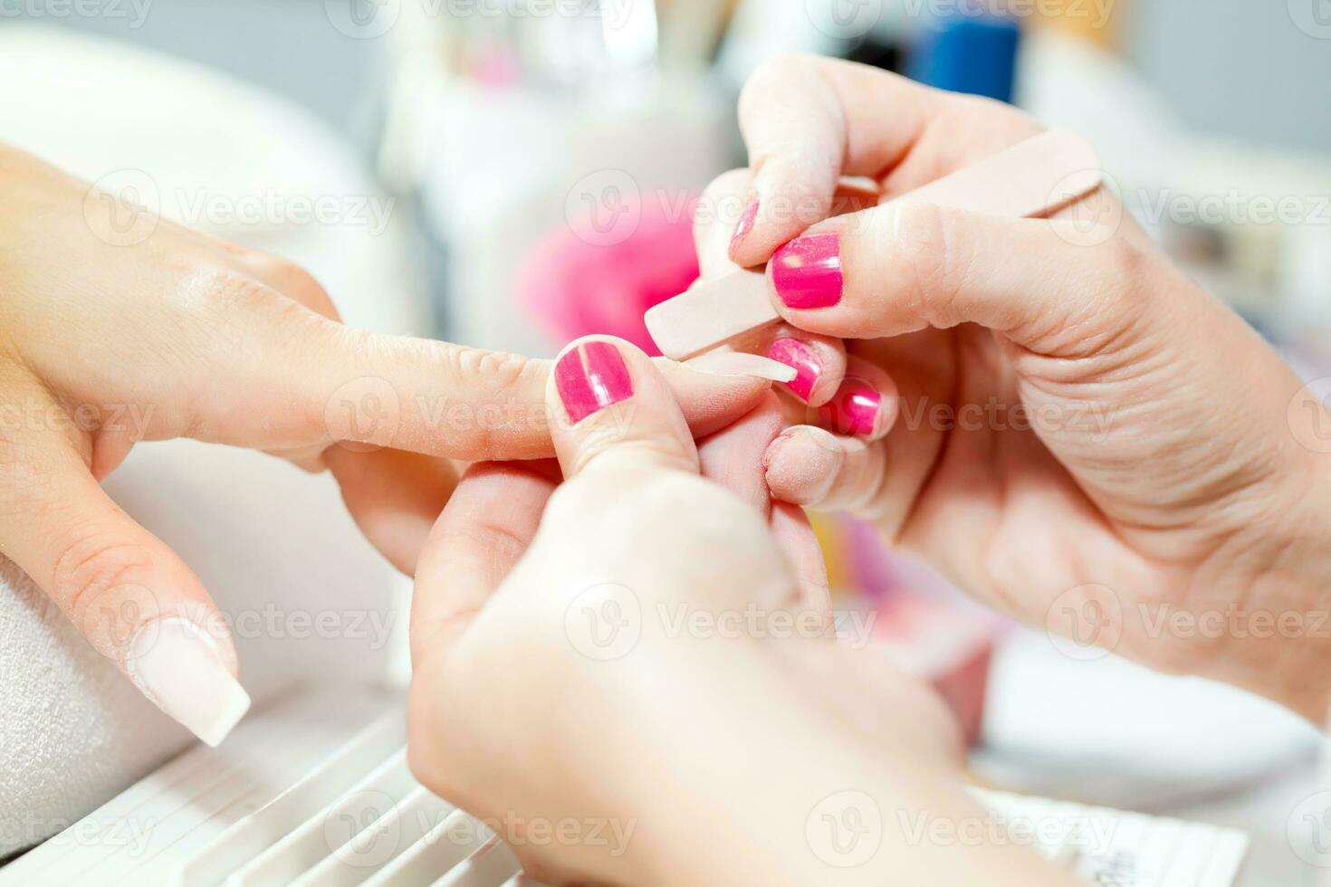 Nail treatment in a beauty salon photo